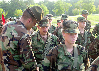 Staff Sgt. Bruce Derdoski gives instructions to a soldier during an early morning formation.